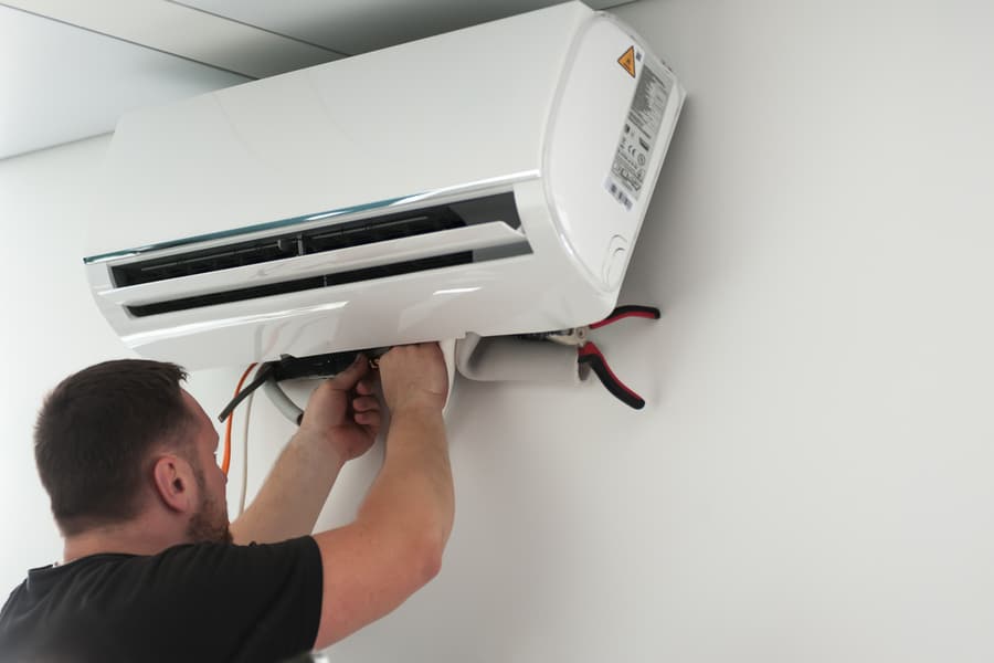 Https://Www.shutterstock.com/Image-Photo/Worker-Connecting-New-Air-Conditioner-Unit-1970755646