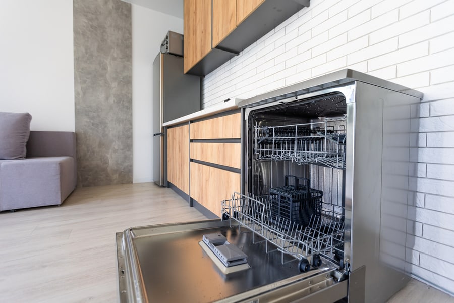 Modern Half Open Empty Dishwasher In A Modern Kitchen