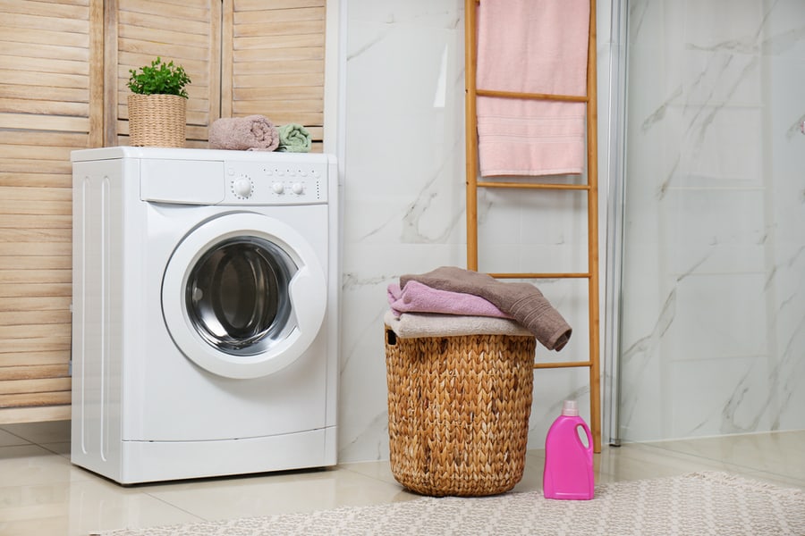 Modern Washing Machine And Laundry In Bathroom