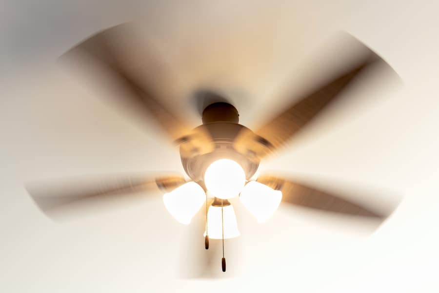 Residential Ceiling Fan In Motion On A White Ceiling