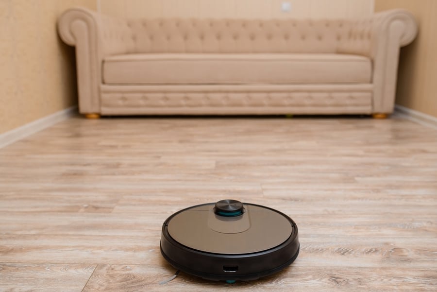 Robot Vacuum Cleaner Is Cleaning The Floor In The Living Room