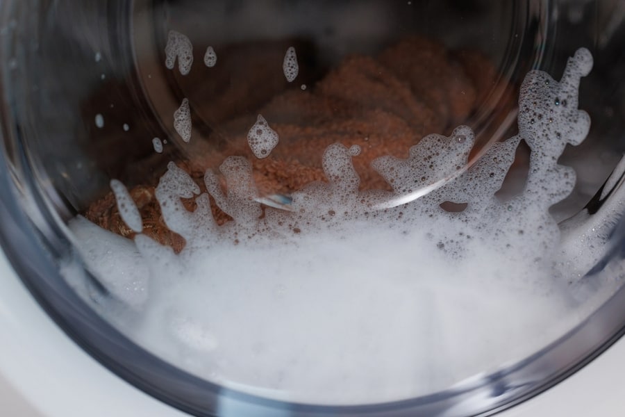 Washing Machine In The Process, Wash Clothes In The Washing Machine, Close-Up Of Cleaning Clothes.