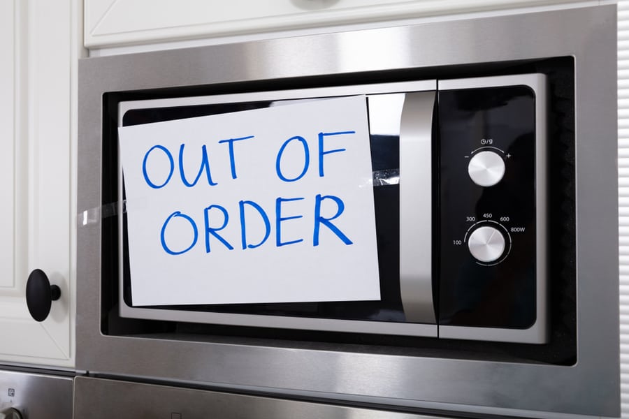Written Text Out Of Order Message On Paper Over The Stuck Microwave